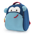 Front view Blue Monkey Backpack - Dabbawalla Bags. Dark blue and light blue panels for smiling face of monkey. Red piping accents top handle.