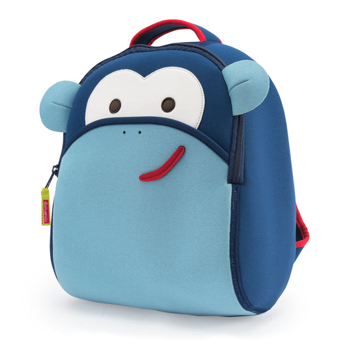 Front view Blue Monkey Backpack - Dabbawalla Bags. Dark blue and light blue panels for smiling face of monkey. Red piping accents top handle. 