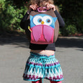 Hoot Owl Lunchbag is being held up by a sweet preschool girl in colorful clothing.