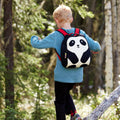 Young boy hiking in the woods with the Panda backpack.