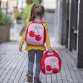 Girl walking home from school carrying Dabbawalla bags machine washable Cherry backpack and lunch bag.