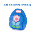 Flower Petal Lunch Bag by Dabbawalla Bags. Modern shapes form a simple flower on the front panel of lunchbox. The bag is a soft blue with pink flower and shade of green leaves. Made of environmentally-responsible, 100% toxic-free material, this machine-washable lunch tote is sized to accommodate a wide-range of food containers.