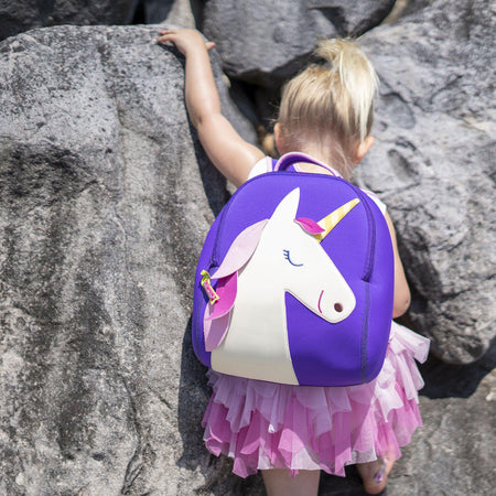 Active preschool girl wearing the Dabbawalla Bags Unicorn backpack Bag material is lightweight, washable and sustainable.