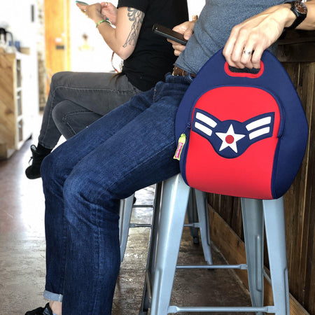 Dad carrying a Dabbawalla lunch bag with a red and blue Captain America theme.
