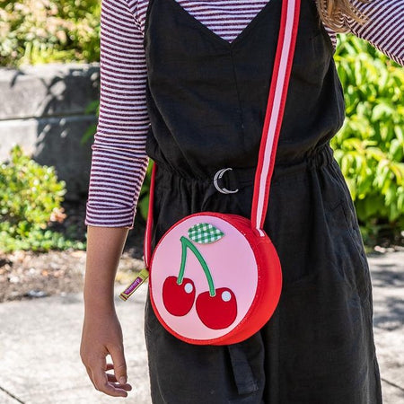 Cherry crossbody bag. Red and pink design crafted from a sustainable foam textile that's degradable, recyclable and friendly to the environment. 