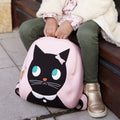 Young girl with close up of Miss Kitty Backpack.  Cute black kitty face is appliqued on the front of a pink bag.