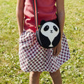 Close-up of Panda Cross-body bag.  Cute black and white panda face . Contrast binding on the adjustable strap.