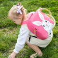 Small girl wearing the Bunny harness backpack.